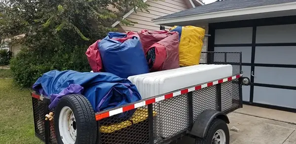 Bouncers R Us trailer loaded with bounce houses ready for delivery